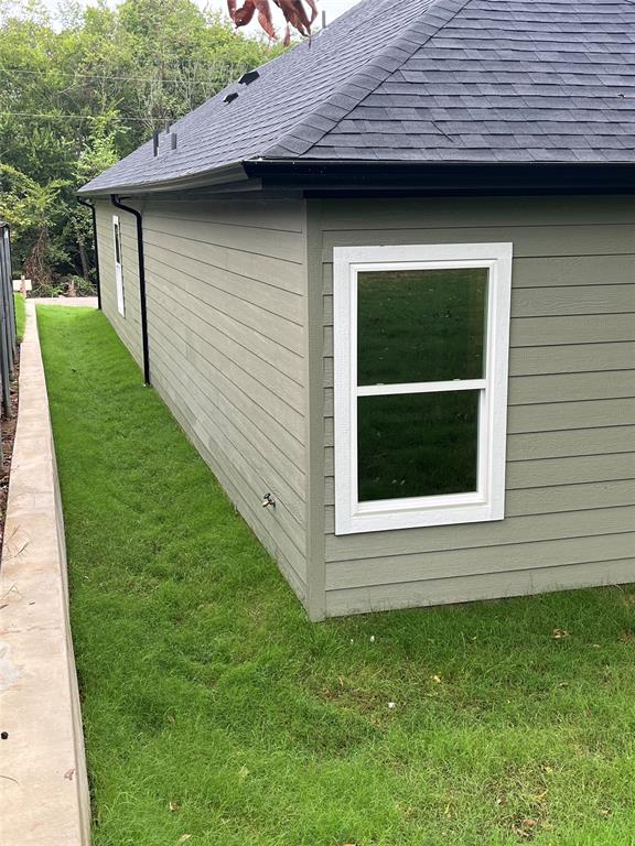 326 West Day Street Denison, TX 75020 - Photo 9 of 27 a view of a backyard of the house