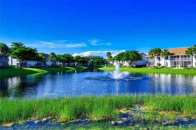 a view of a lake with a yard