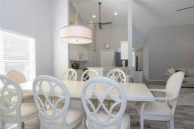 a dining room with furniture a table and chairs