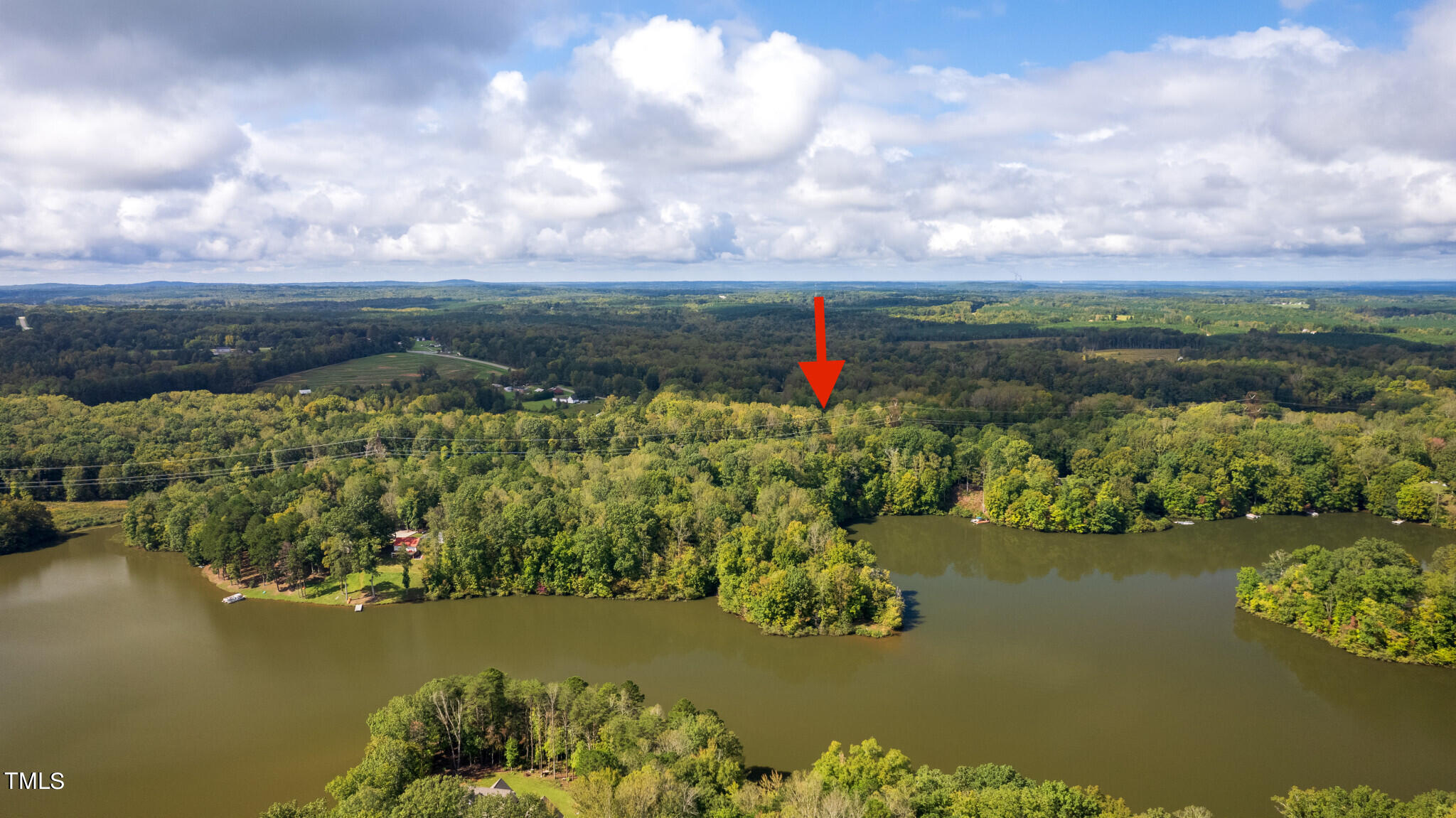 0 Beaver Crossing Road Roxboro, NC 27574 - Photo 7 of 8 a view of a lake with a houses