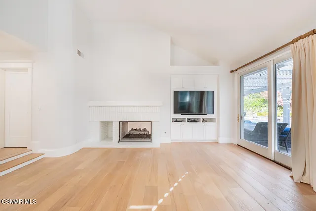a living room with a couch and a flat screen tv