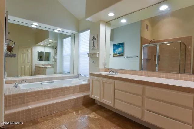 a bathroom with a sink and a large mirror