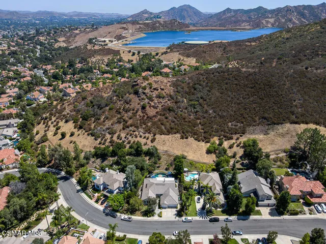 an aerial view of residential house and sandy dunes