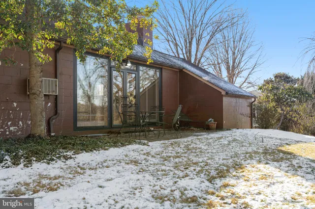 a view of yard with wooden fence