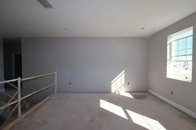 a view of an empty room with a window