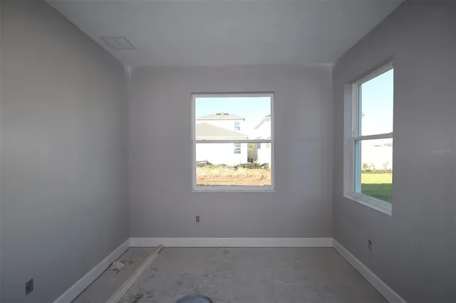 an empty room with windows