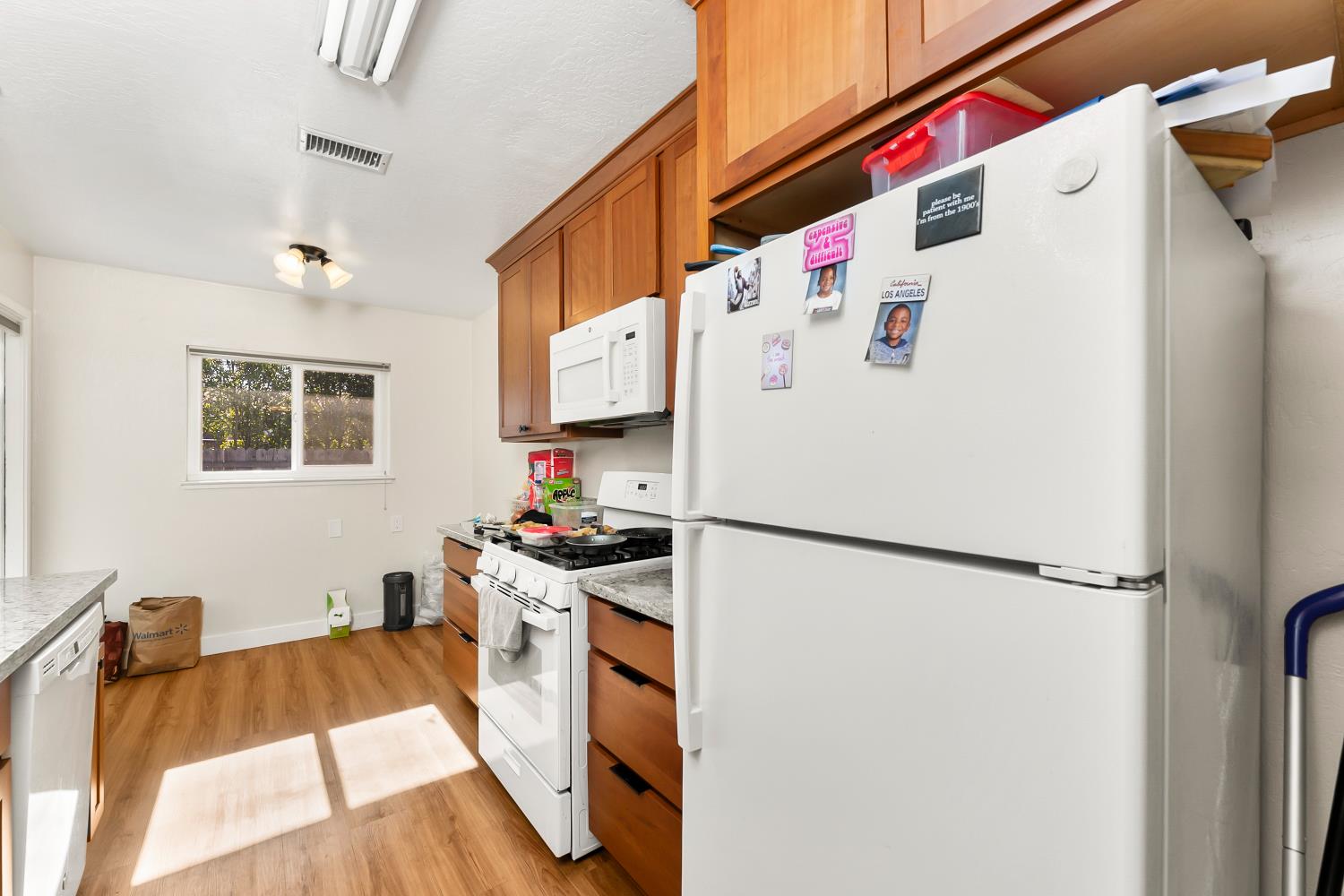 3620 Sean Drive Sacramento, CA 95821 - Photo 11 of 23 a white refrigerator freezer sitting inside of a kitchen