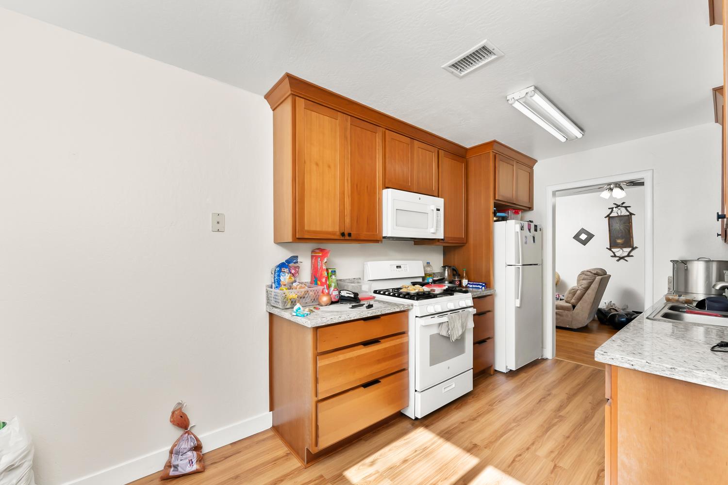 3620 Sean Drive Sacramento, CA 95821 - Photo 13 of 23 a kitchen with stainless steel appliances granite countertop a stove and a refrigerator