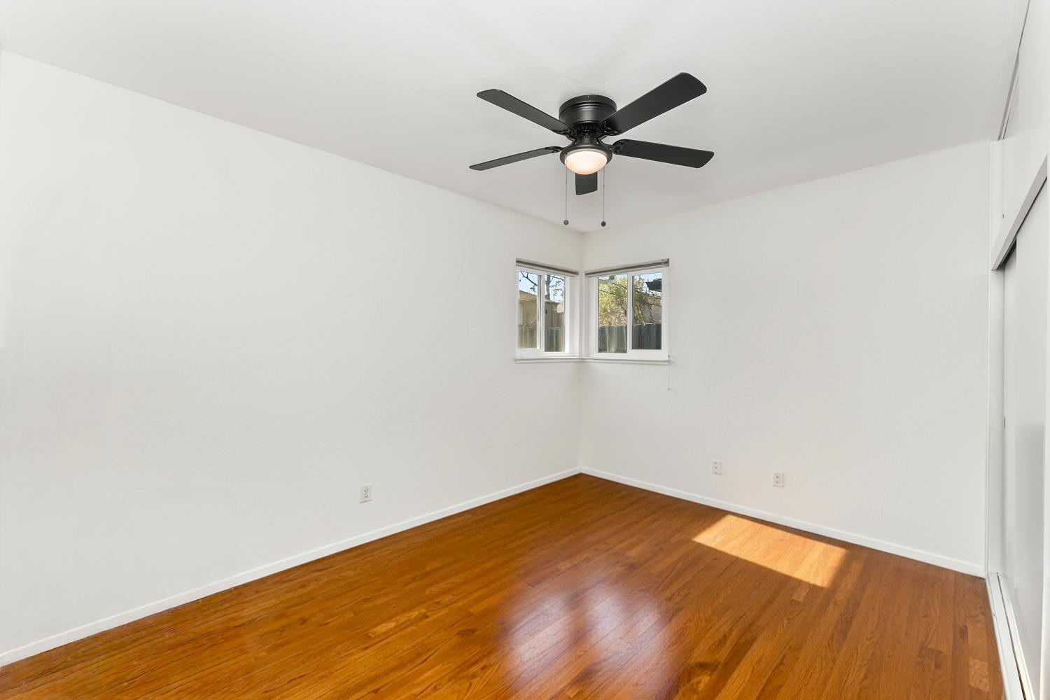 3620 Sean Drive Sacramento, CA 95821 - Photo 14 of 23 an empty room with a window and ceiling fan