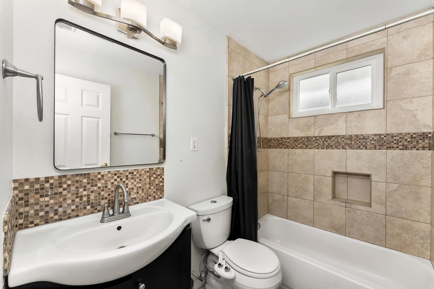 3620 Sean Drive Sacramento, CA 95821 - Photo 17 of 23 a bathroom with a sink a toilet and shower