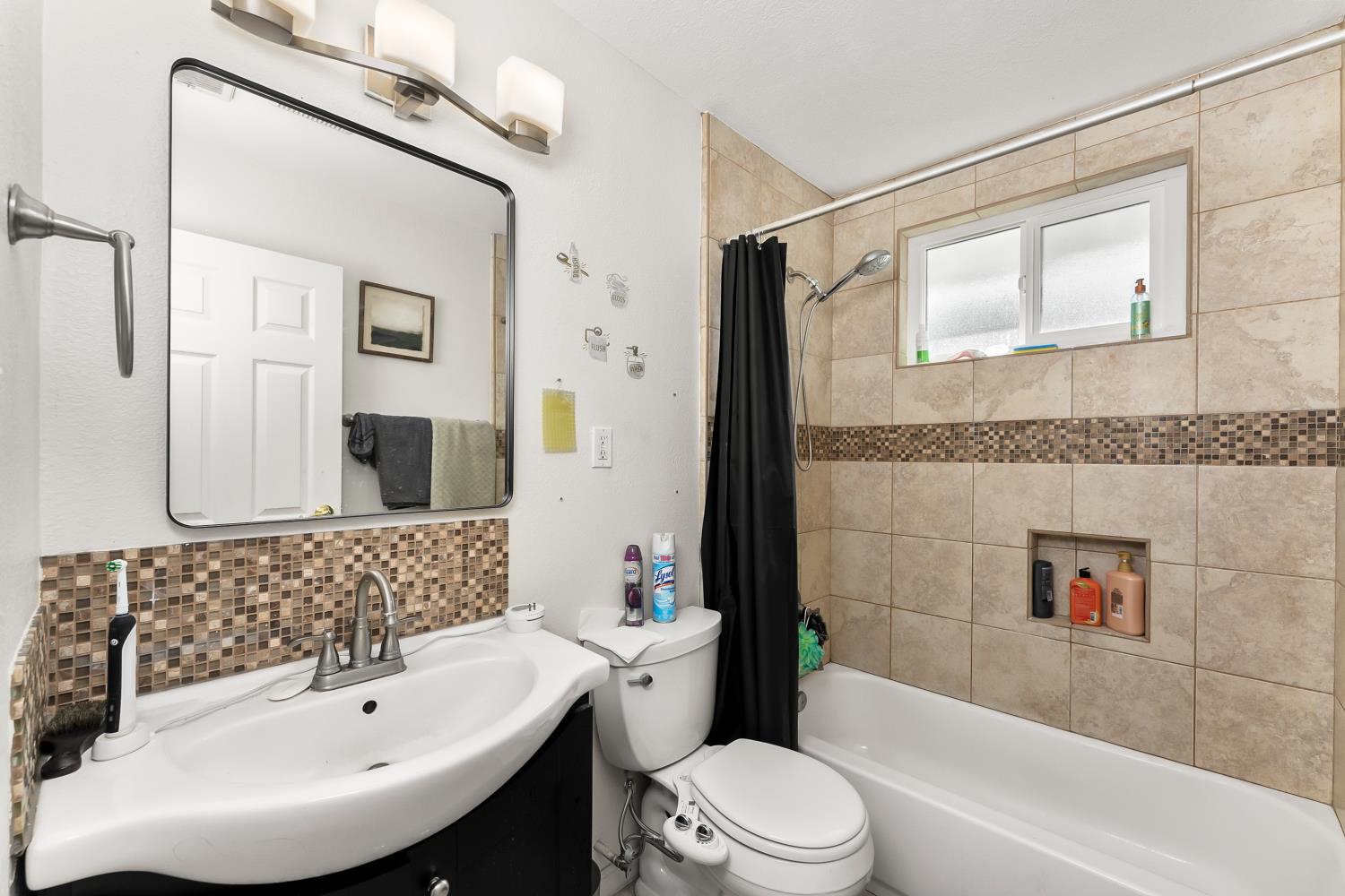 3620 Sean Drive Sacramento, CA 95821 - Photo 18 of 23 a bathroom with a sink a toilet and shower