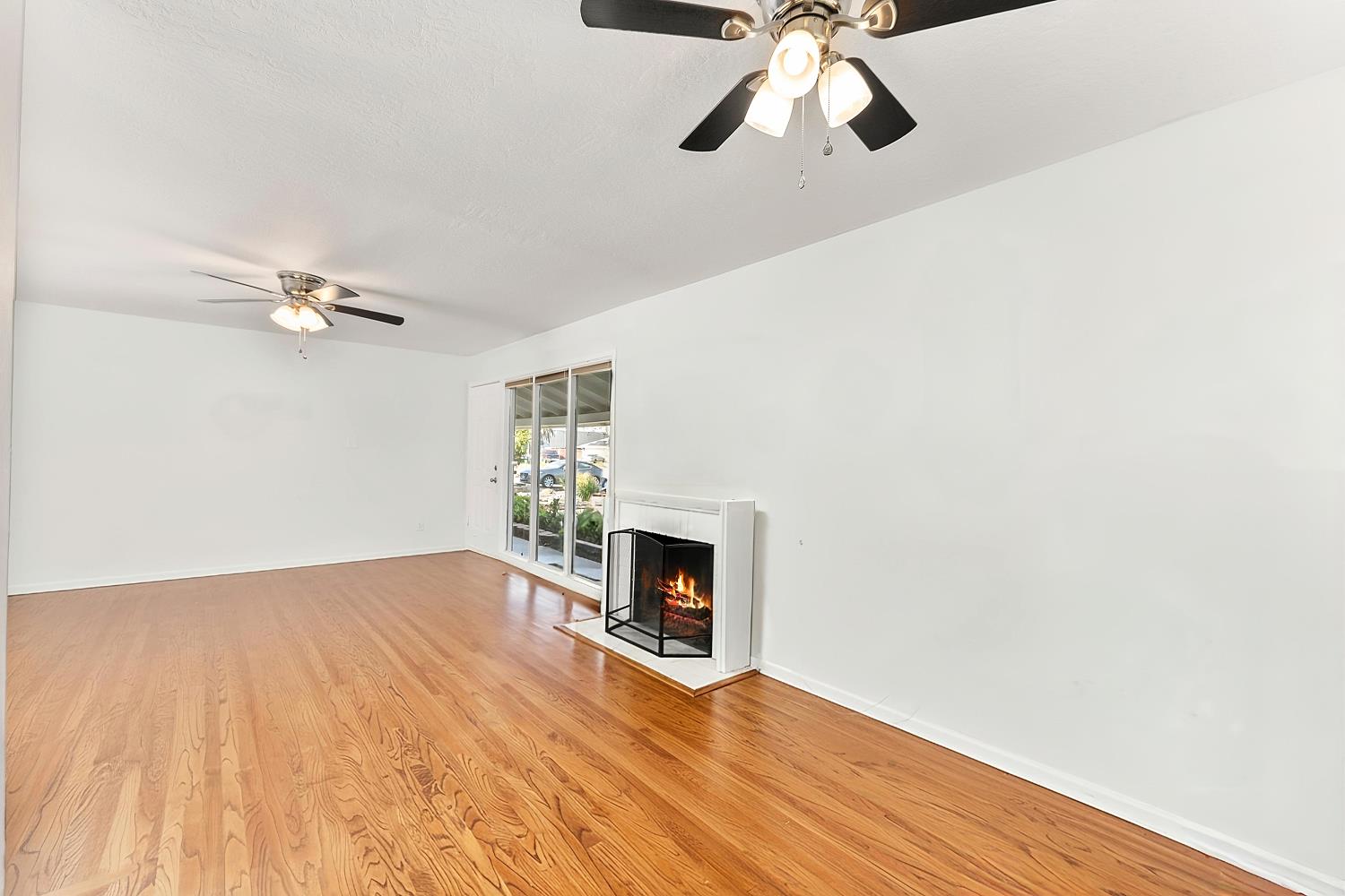 3620 Sean Drive Sacramento, CA 95821 - Photo 4 of 23 a view of empty room with wooden floor and fireplace