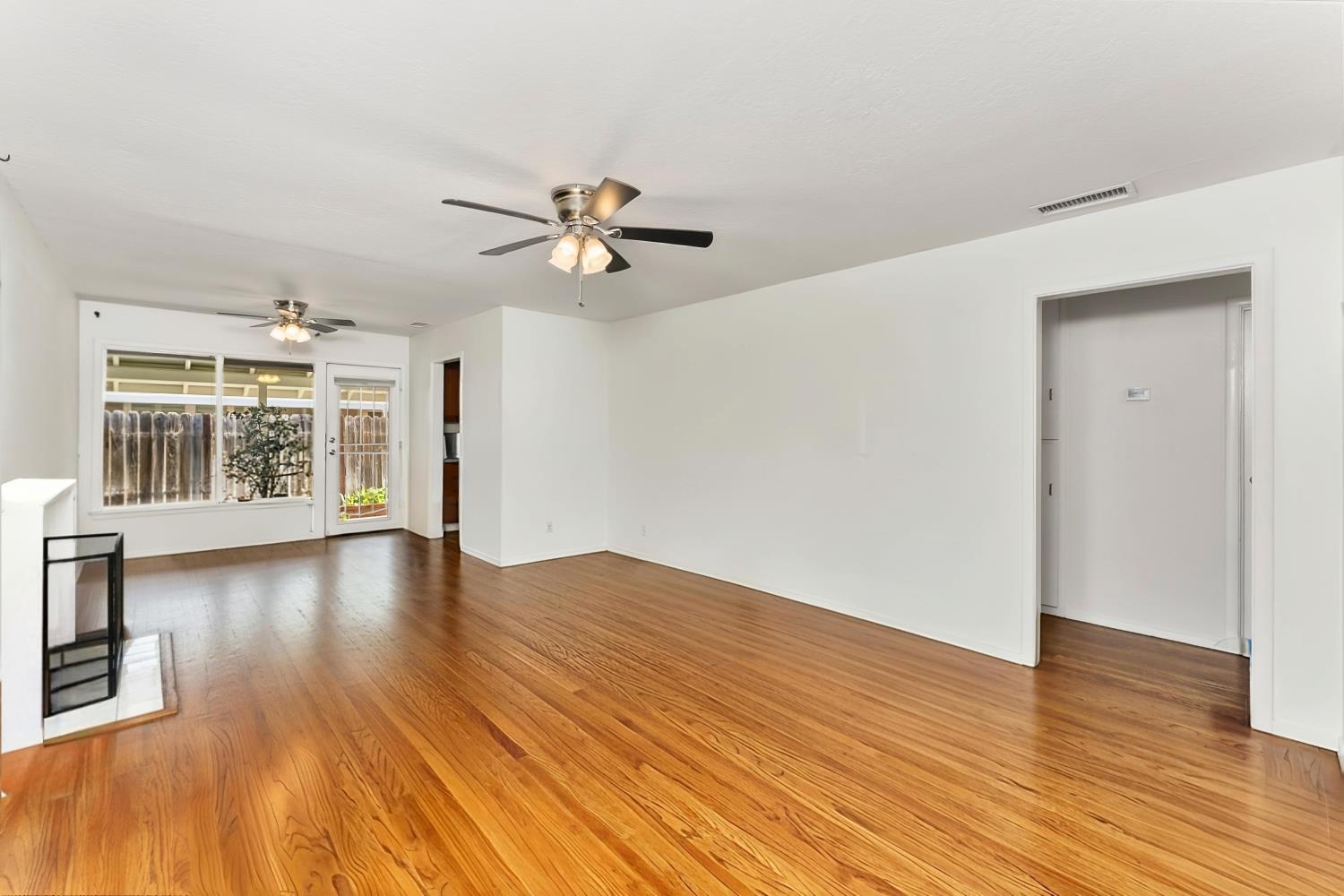 3620 Sean Drive Sacramento, CA 95821 - Photo 7 of 23 a view of empty room with wooden floor and fan