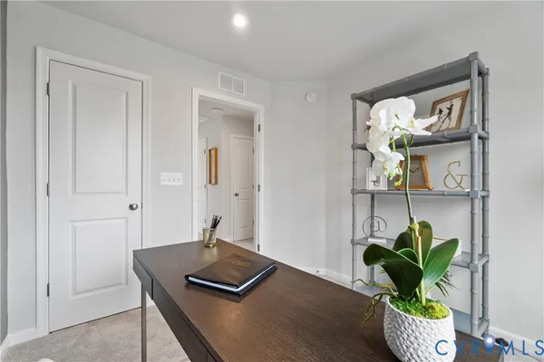 a view of workspace filled with furniture