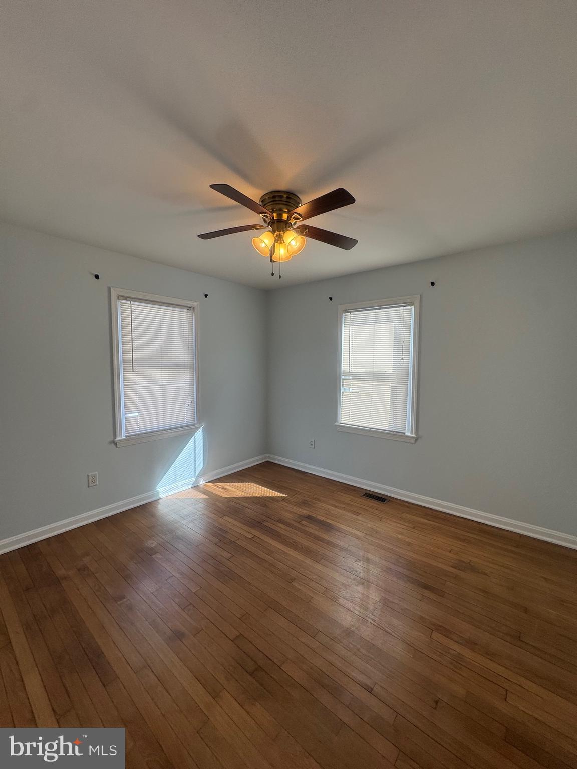 11370 Ridge Road King George, VA 22485 - Photo 12 of 17 a view of an empty room with wooden floor and a window