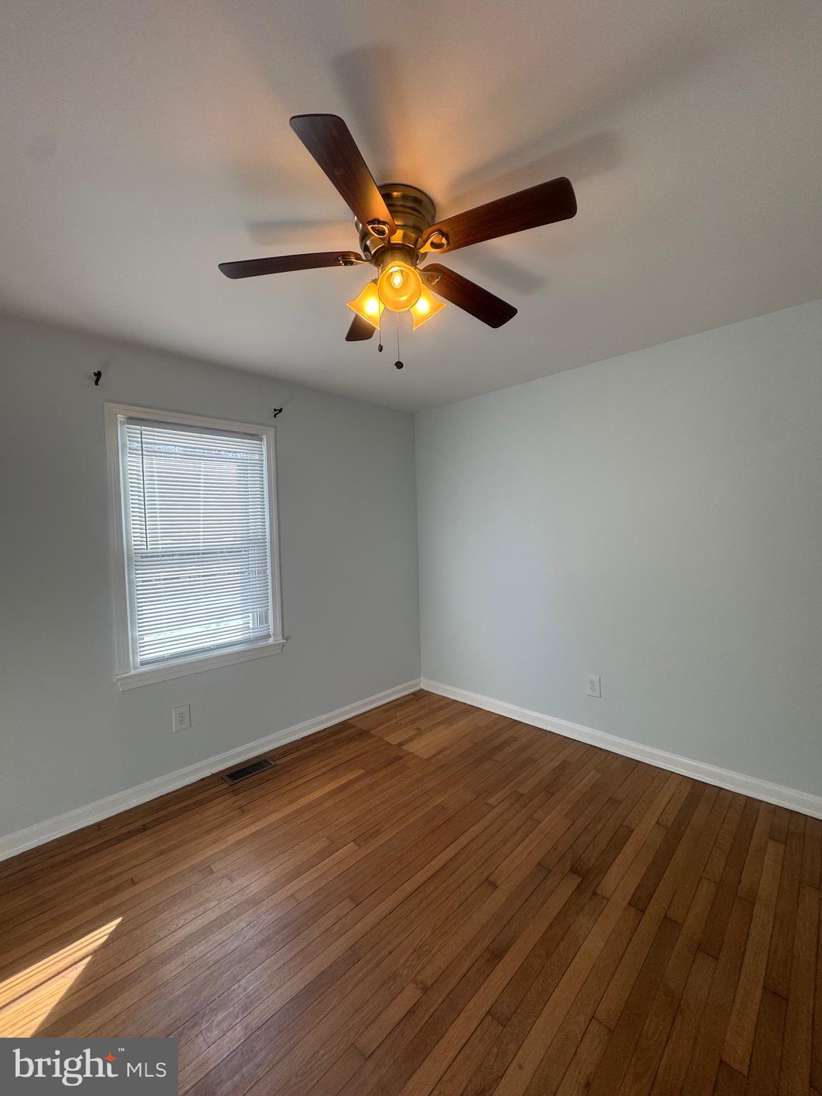 11370 Ridge Road King George, VA 22485 - Photo 14 of 17 a view of an empty room with window and chandelier fan