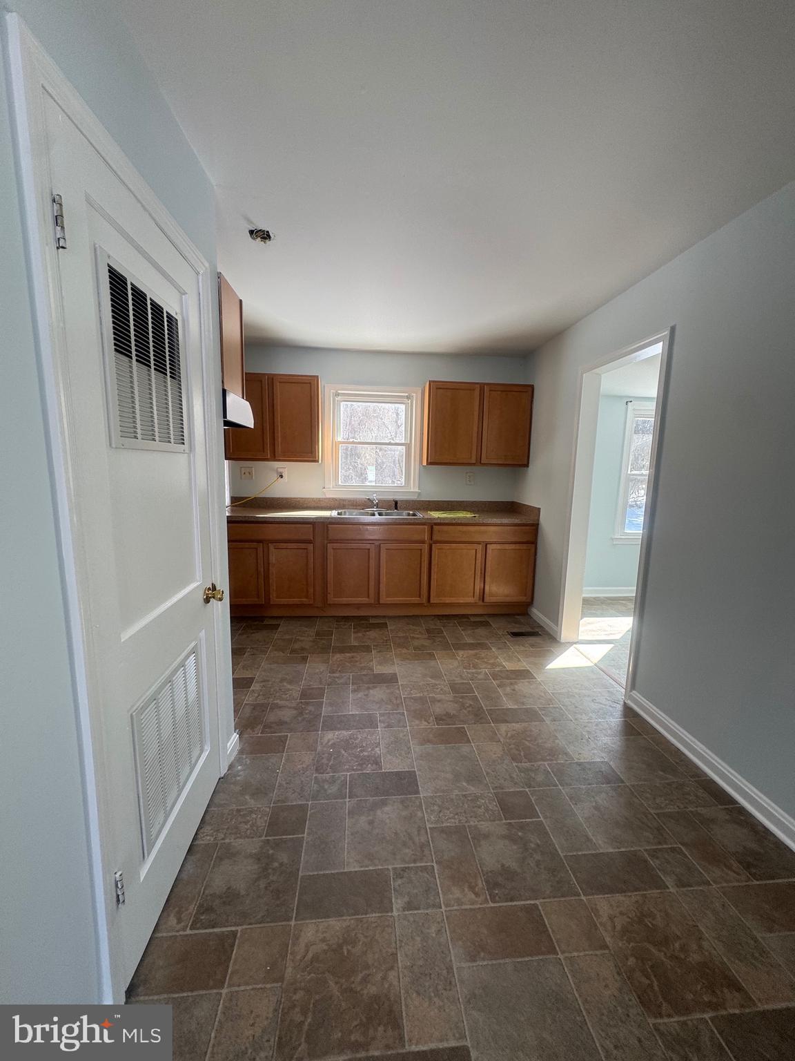 11370 Ridge Road King George, VA 22485 - Photo 15 of 17 a kitchen with stainless steel appliances a stove a sink and a refrigerator