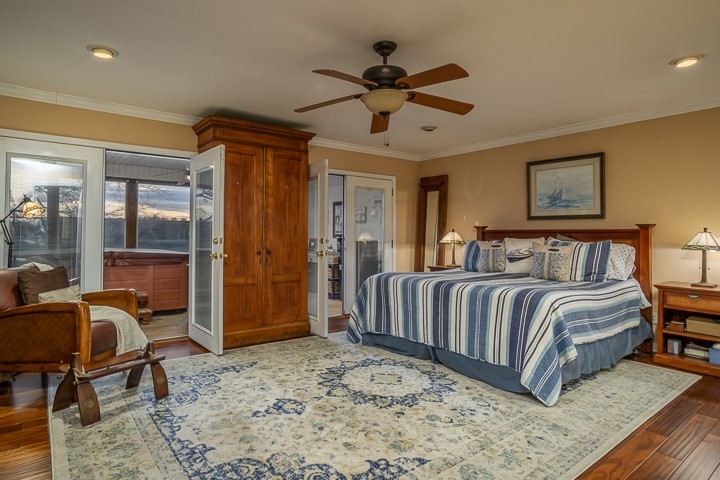 812 Burton Point Road Mount Juliet, TN 37122 - Photo 18 of 29 a bedroom with a bed and glass table