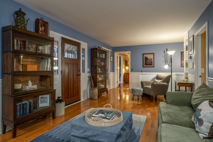 812 Burton Point Road Mount Juliet, TN 37122 - Photo 19 of 29 a living room with furniture and a book shelf