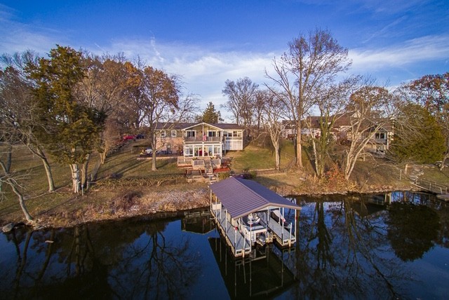 812 Burton Point Road Mount Juliet, TN 37122 - Photo 2 of 29 a view of a house with pool and trees