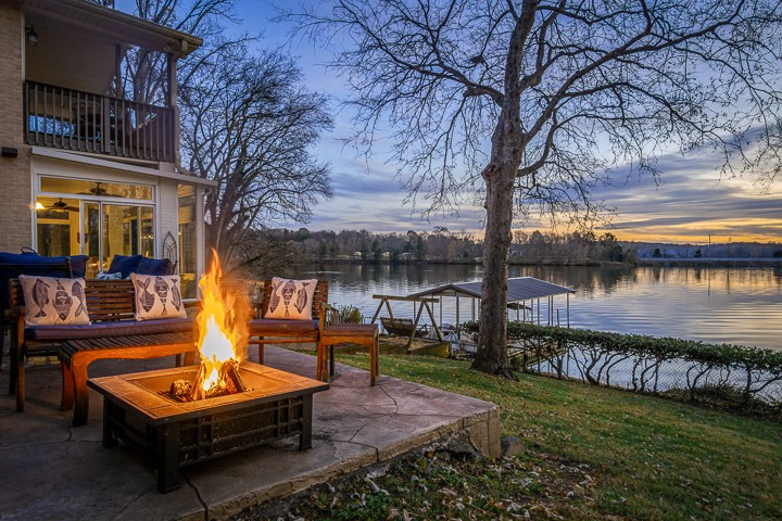 812 Burton Point Road Mount Juliet, TN 37122 - Photo 10 of 29 a bench sitting in front of a house with a yard