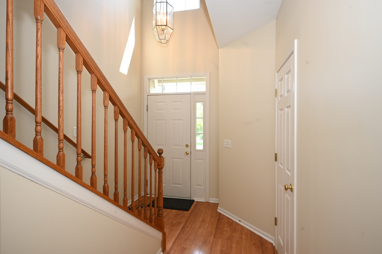 573 Telluride Drive Gilberts, IL 60136 - Photo 12 of 24 a view of a hallway with wooden floor and staircase