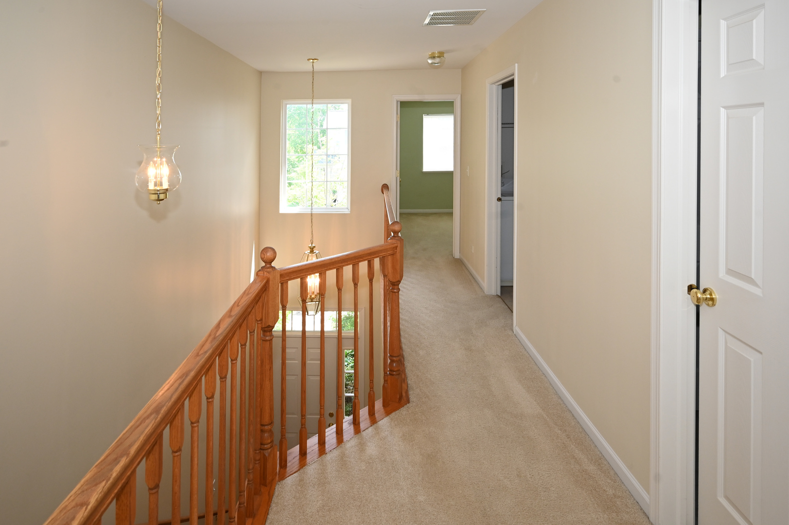 573 Telluride Drive Gilberts, IL 60136 - Photo 21 of 24 a view of a hallway with wooden floor and staircase