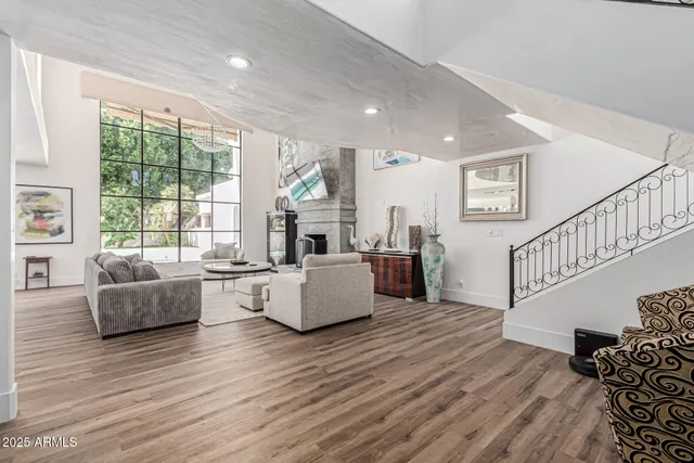 a kitchen with granite countertop a table chairs stove and cabinets
