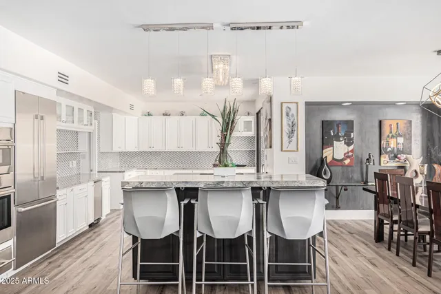 a view of a hallway with paintings on the wall