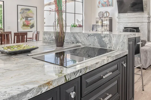 a spacious bedroom with a bed and a painting on the wall