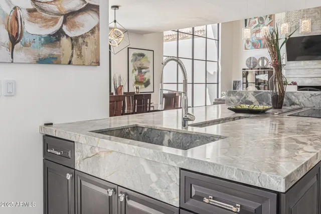 a bedroom with a bed a flat tv screen and large window