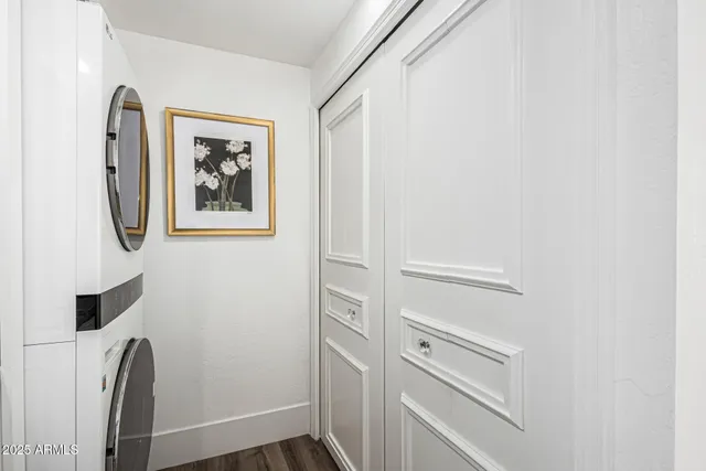 a bedroom with a large bed and a balcony view