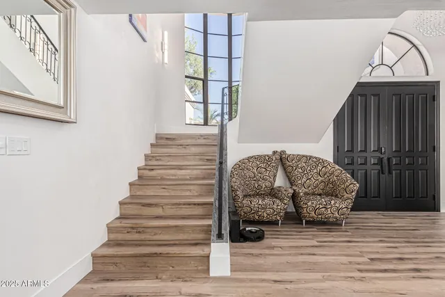 a spacious bathroom with a sink and a mirror