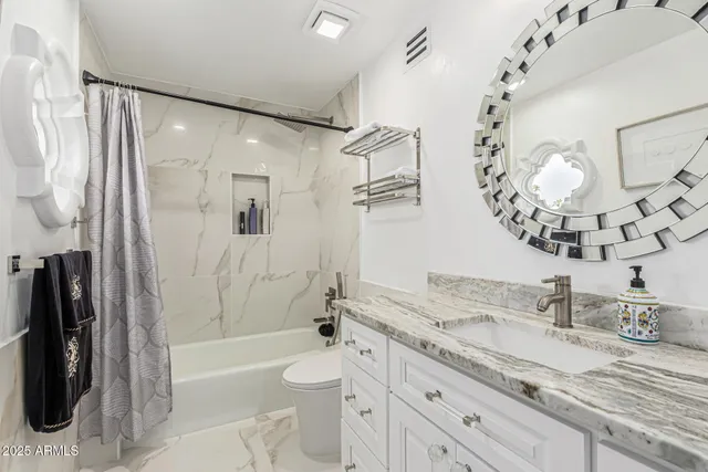 a view of a swimming pool with outdoor seating