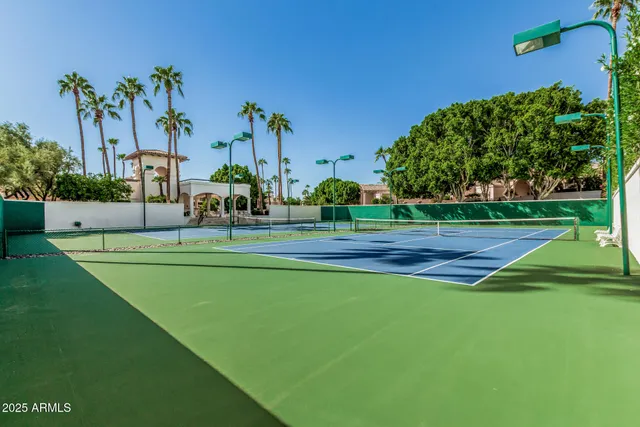 a view of a house with swimming pool and sitting area