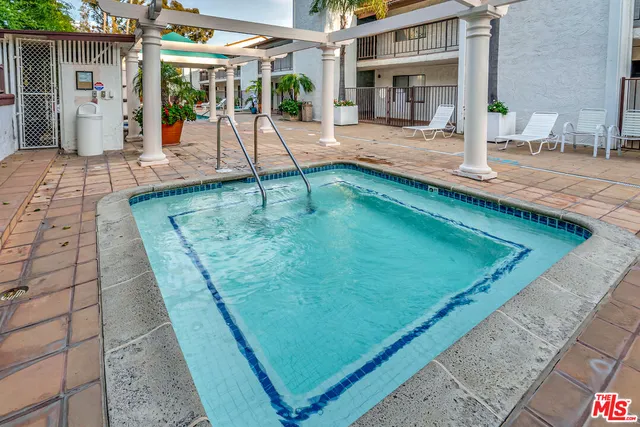 a view of a house with a yard and plants