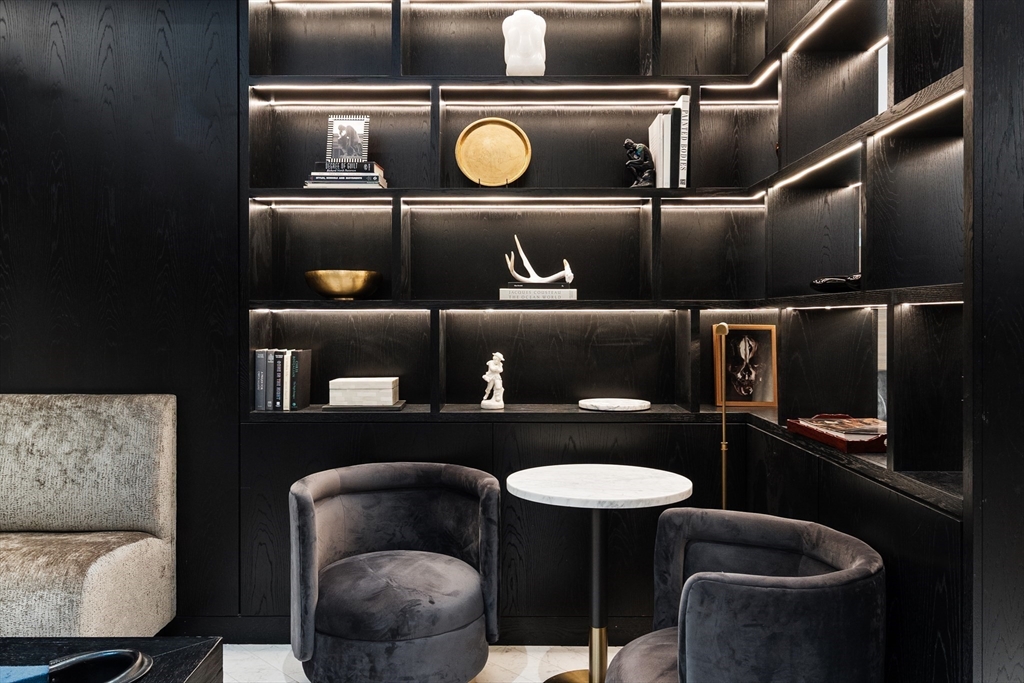 55 Lagrange Street, Unit 1804 Boston, MA 02116 - Photo 27 of 28 a kitchen with a refrigerator and breakfast area