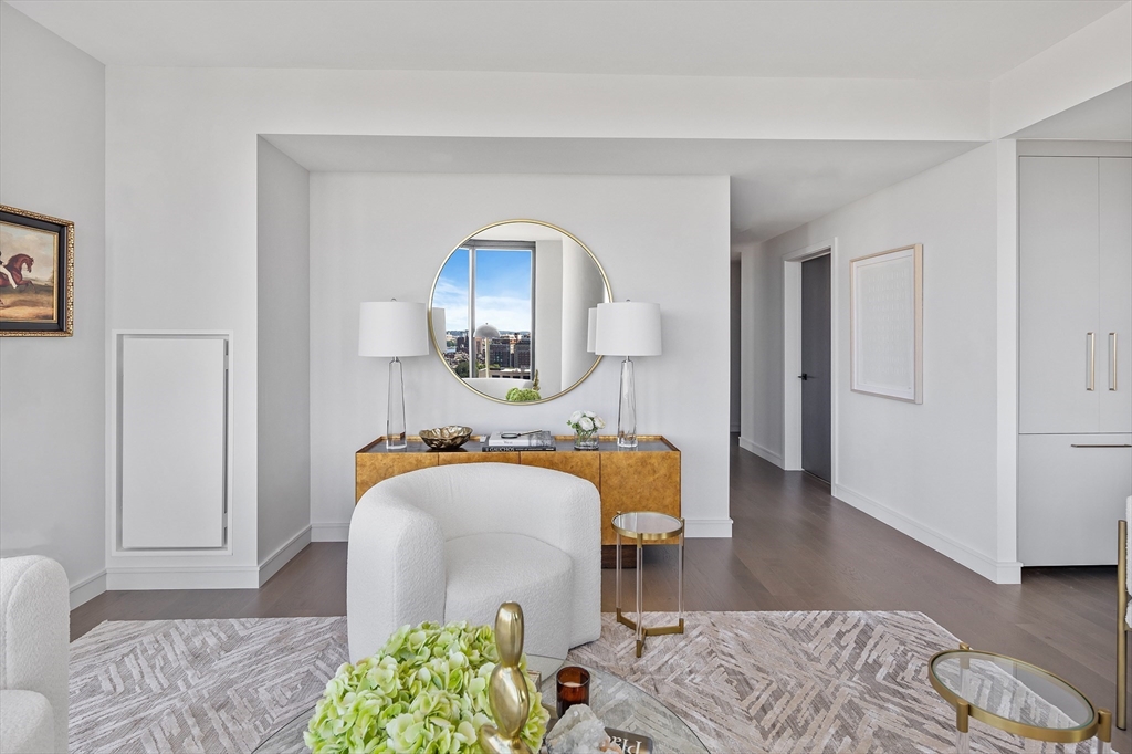 55 Lagrange Street, Unit 1804 Boston, MA 02116 - Photo 5 of 28 a bedroom with furniture and a wooden floor