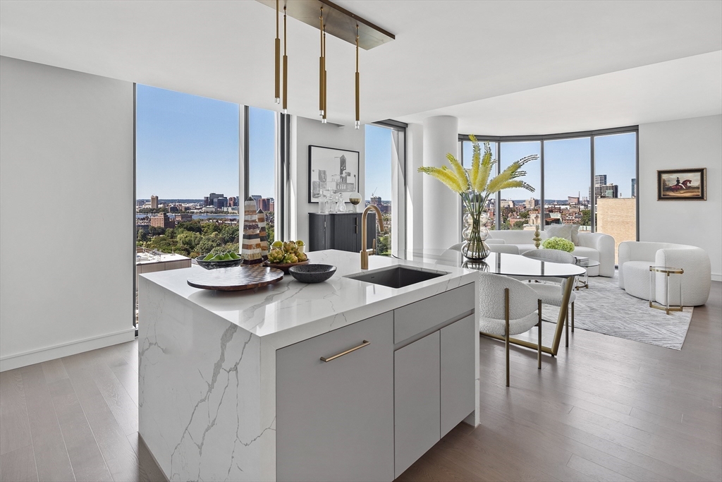 55 Lagrange Street, Unit 1804 Boston, MA 02116 - Photo 9 of 28 a kitchen with a sink cabinets and wooden floor