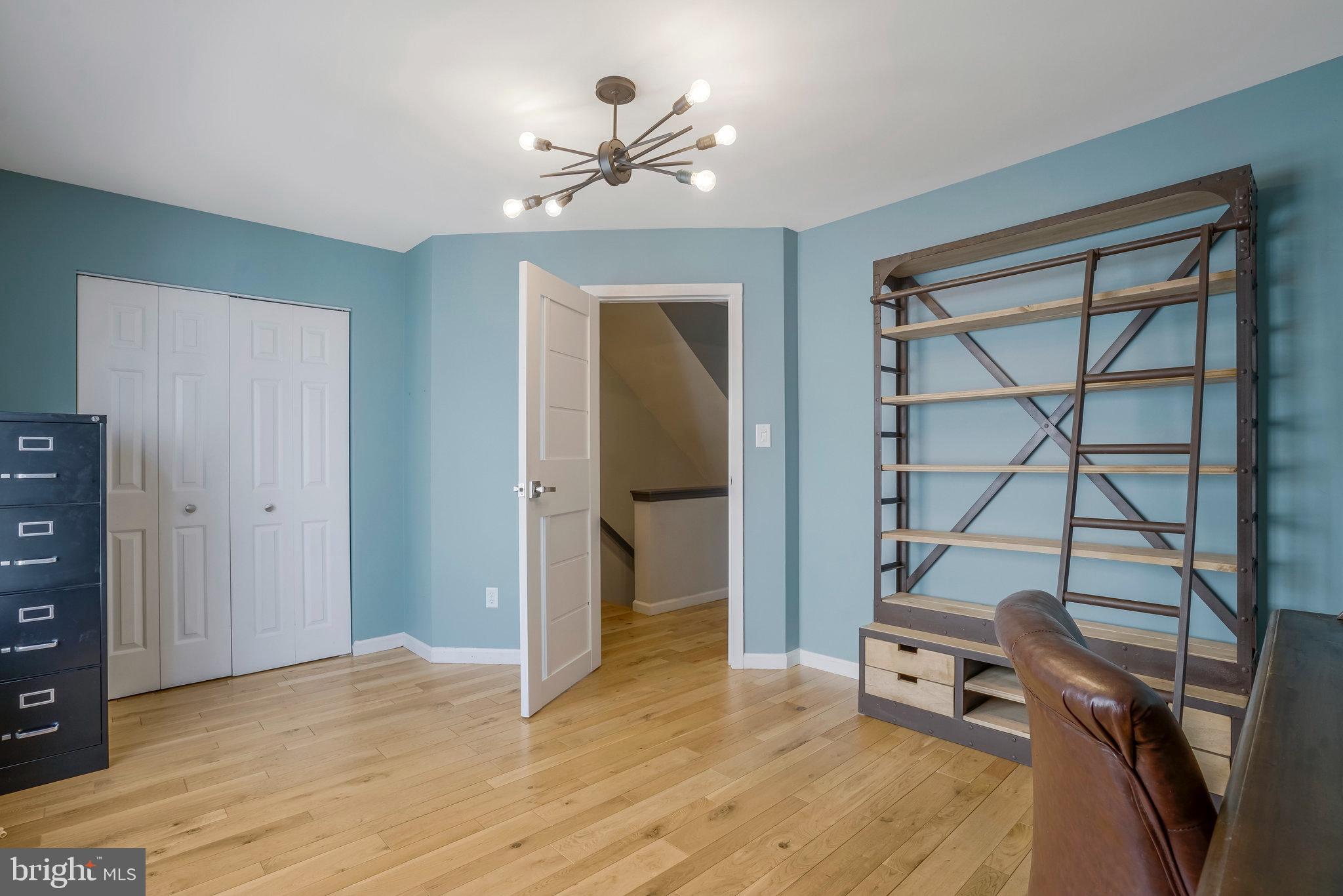 2181 Shirlington Road Arlington, VA 22206 - Photo 21 of 48 a view of room with workspace and wooden floor