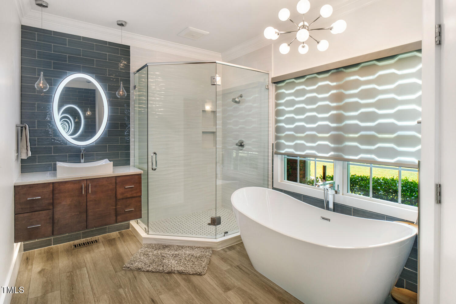 412 Bowen Road Rougemont, NC 27572 - Photo 13 of 40 a spacious bathroom with a bathtub a sink and a large mirror