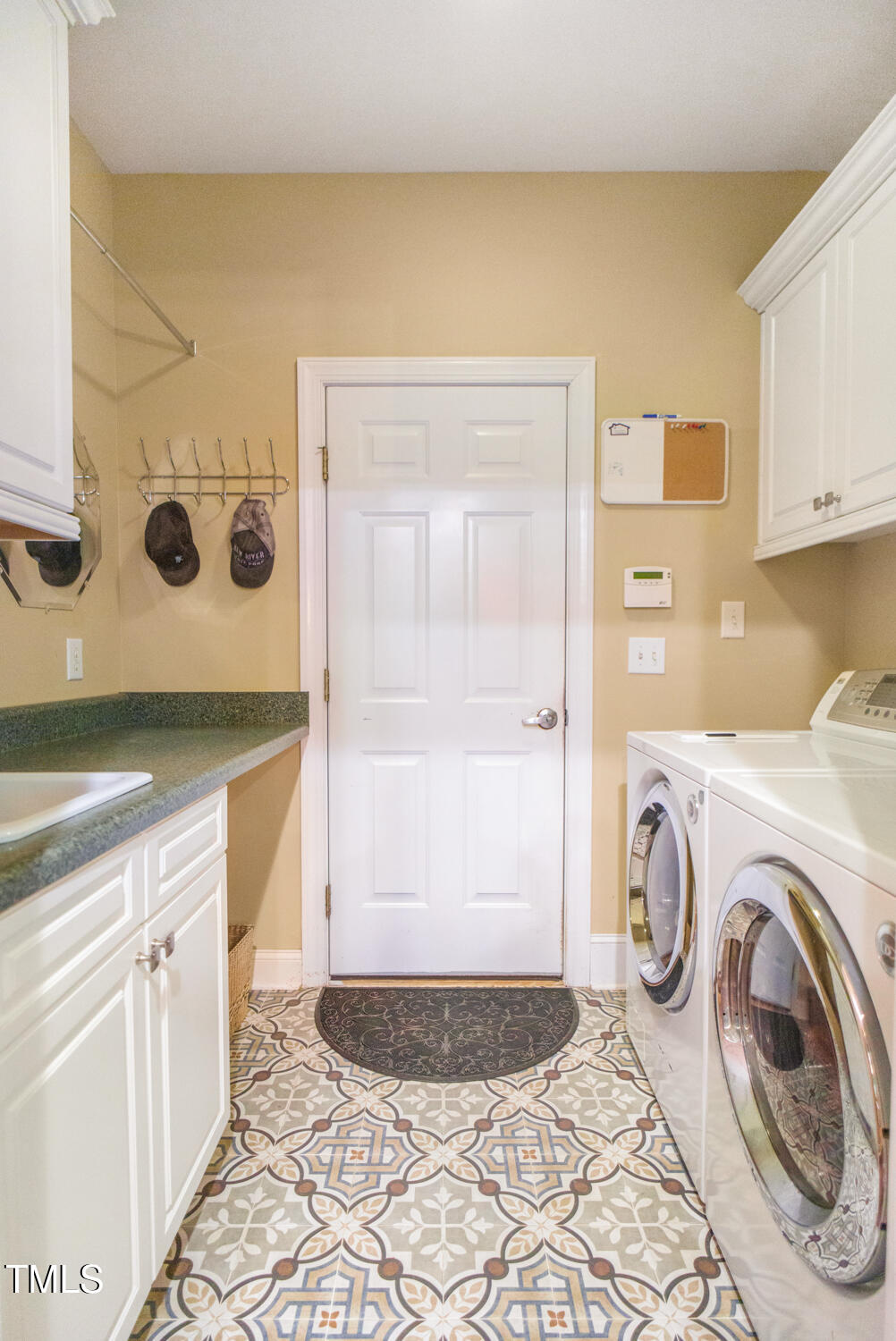 412 Bowen Road Rougemont, NC 27572 - Photo 32 of 40 a spacious bathroom with a granite countertop sink and a mirror