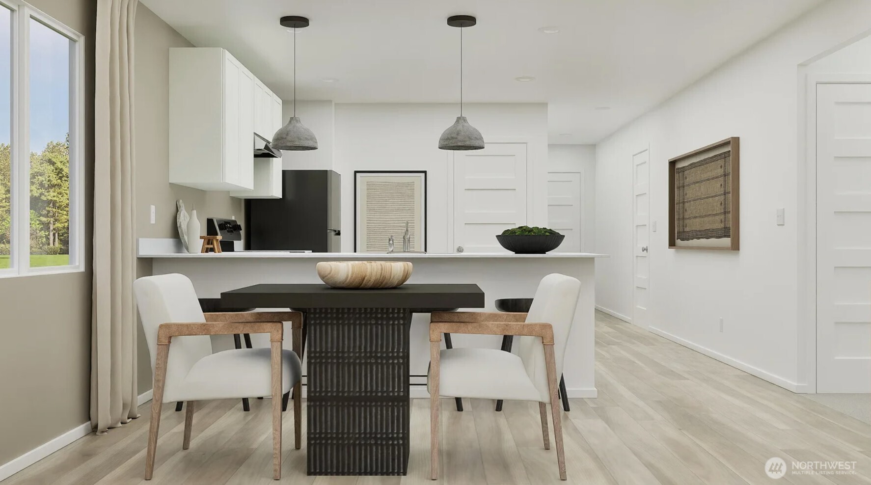 153 Moonshadow Lane Sequim, WA 98382 - Photo 3 of 16 a kitchen with stainless steel appliances kitchen island granite countertop a table chairs in it and wooden floors