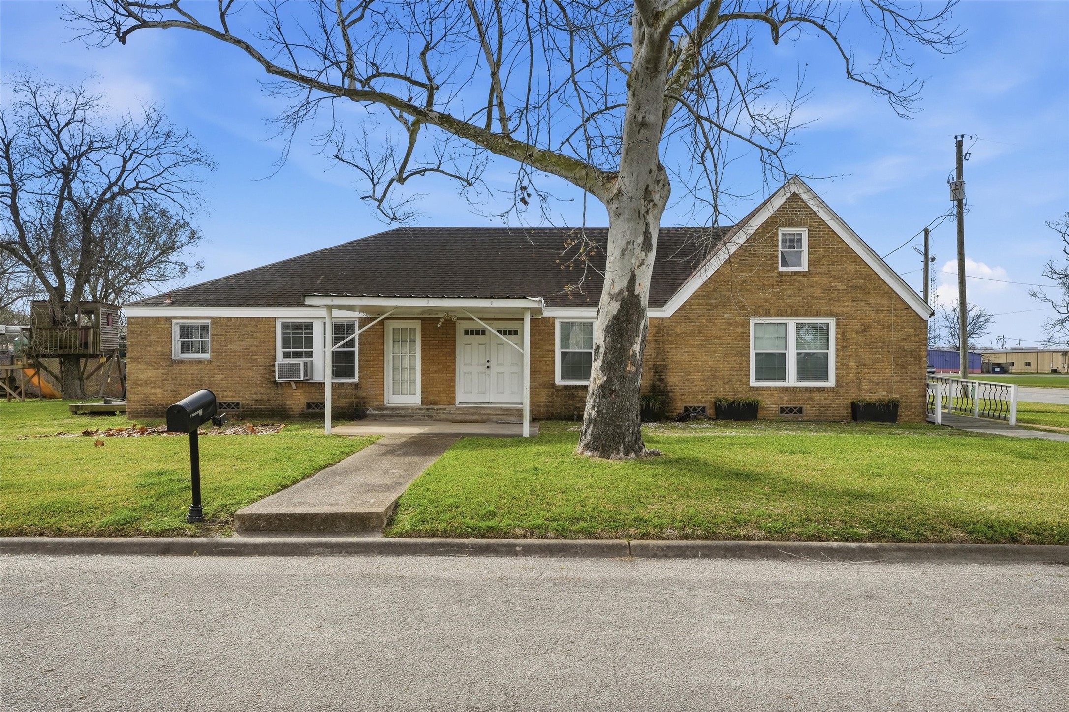 a front view of a house with a yard