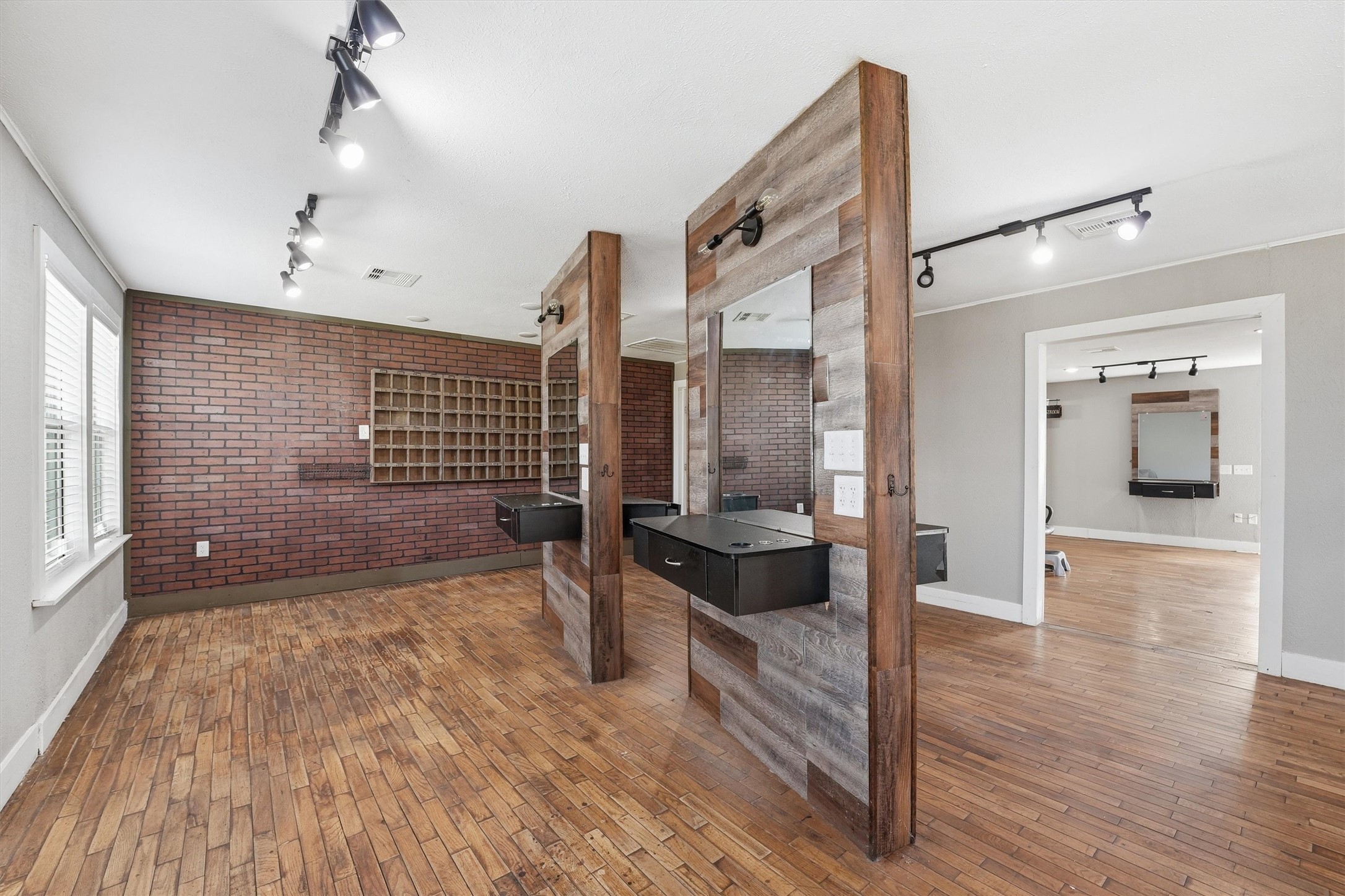 403 South Velasco Street Angleton, TX 77515 - Photo 17 of 25 a view of a hallway with wooden floor and a living room