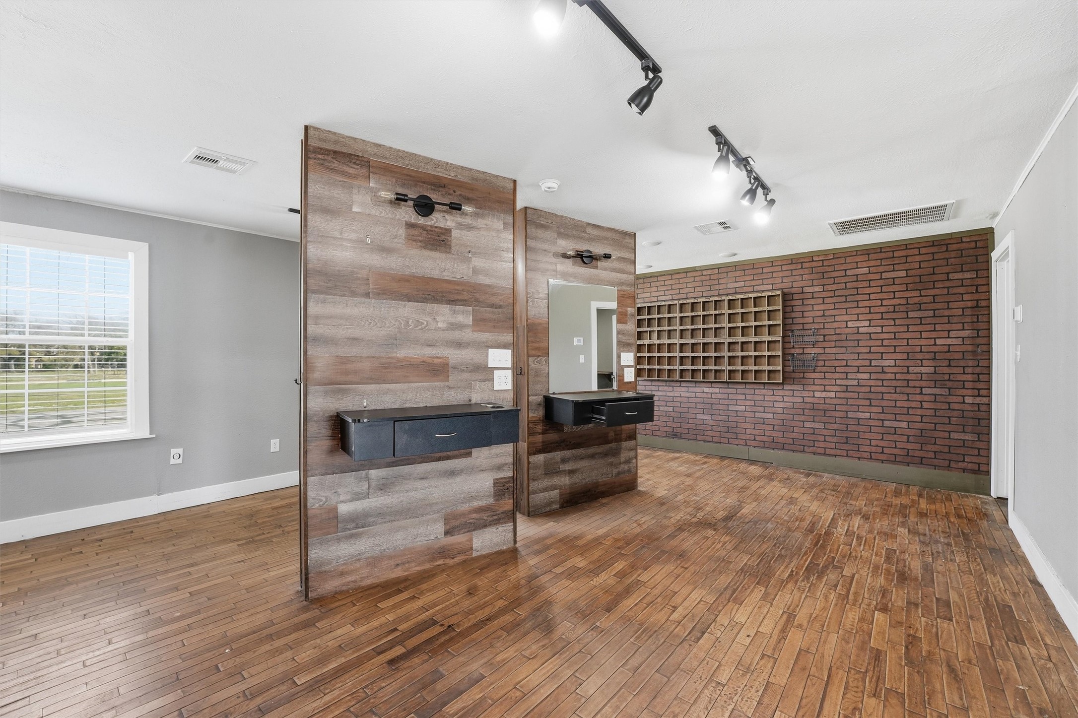 403 South Velasco Street Angleton, TX 77515 - Photo 18 of 25 a view of a livingroom with wooden floor