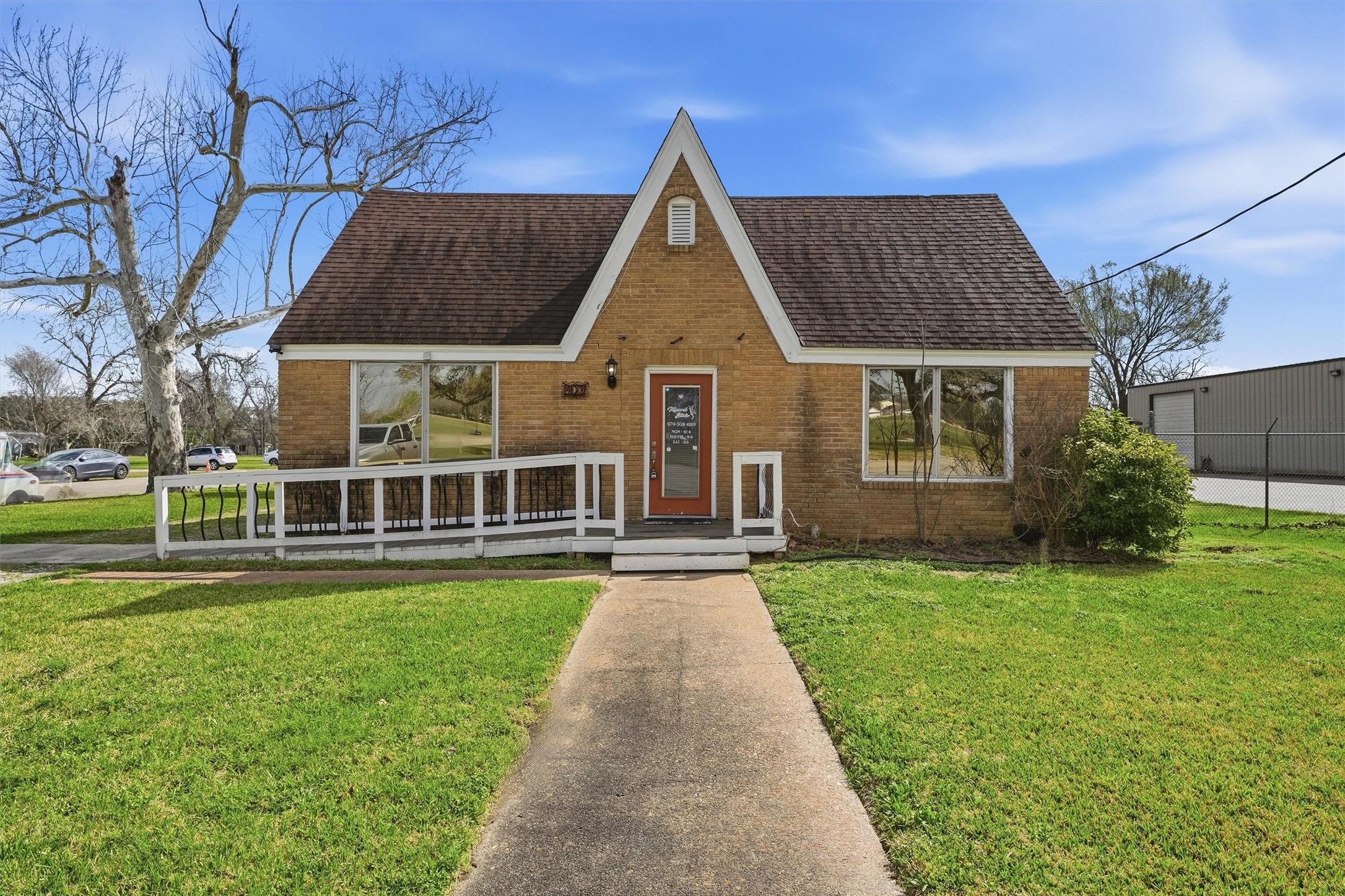 403 South Velasco Street Angleton, TX 77515 - Photo 23 of 25 a front view of a house with a yard