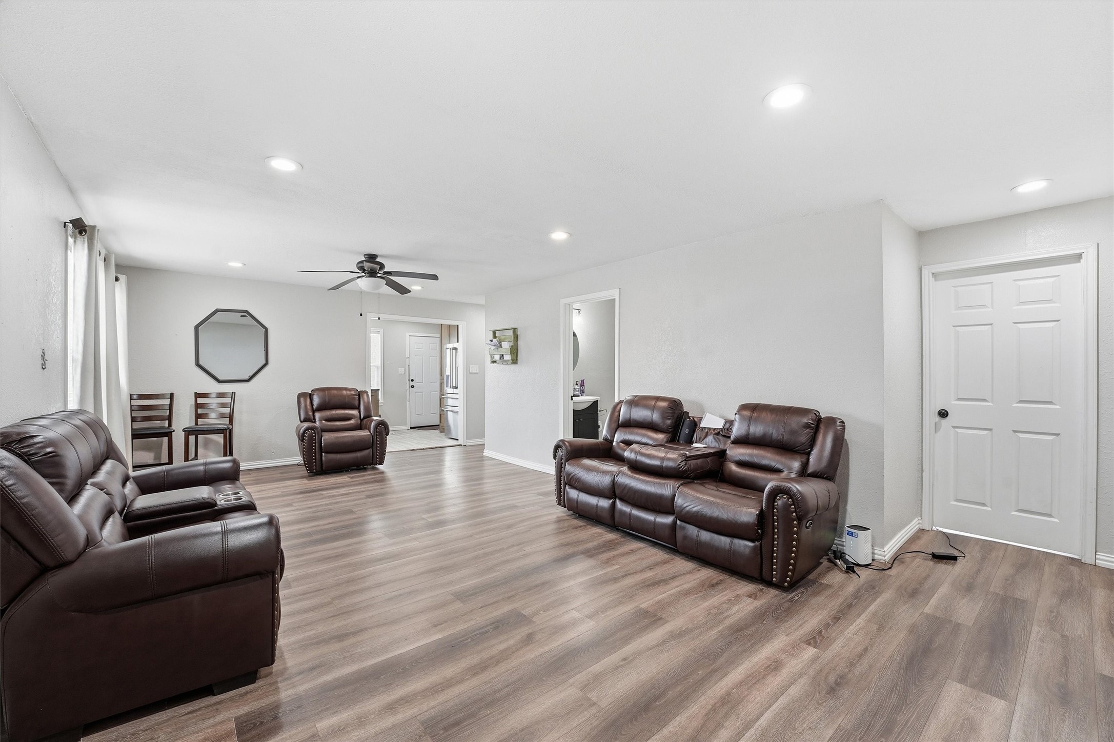 403 South Velasco Street Angleton, TX 77515 - Photo 3 of 25 a living room with furniture and a fireplace