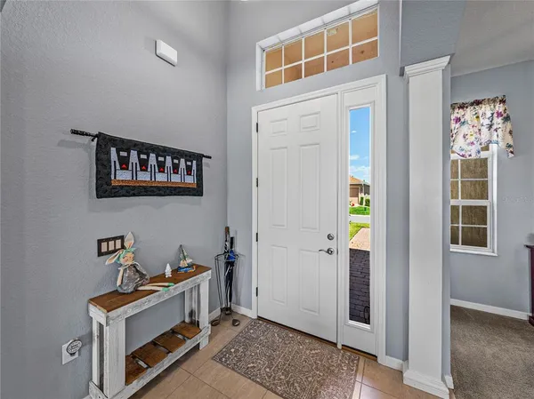a view of livingroom with furniture wooden floor and windows