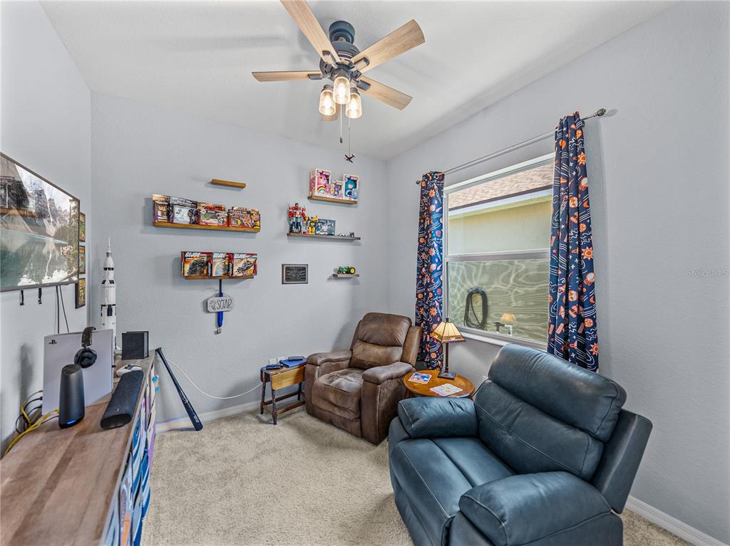 1124 Sawgrass Drive Winter Haven, FL 33859 - Photo 36 of 85 a living room with furniture and a window